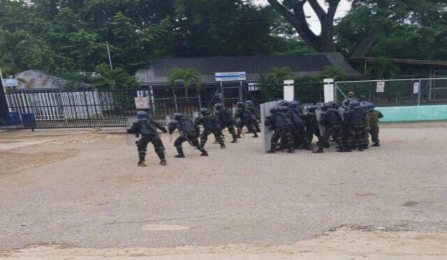 Soldiers with riot gear are on the ground at the Western Border 1